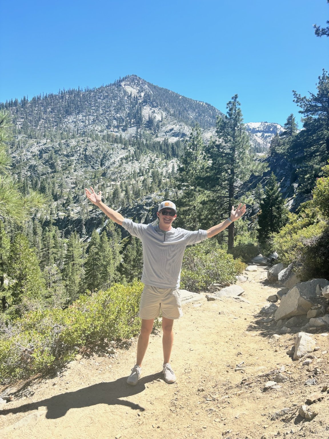 Blake Scarbrough hiking on a mountain trail